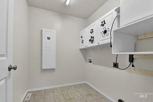 laundry area with light floors, baseboards, cabinet space, electric dryer hookup, and washer hookup