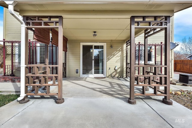 view of patio featuring fence