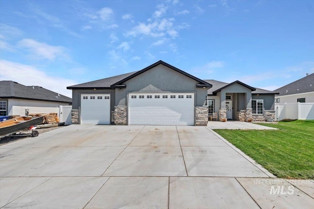 view of front of house featuring a garage and a front lawn