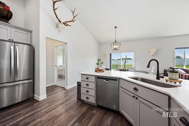 kitchen with stainless steel appliances, plenty of natural light, and gray cabinetry