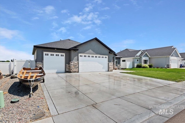 ranch-style home featuring a front yard and a garage