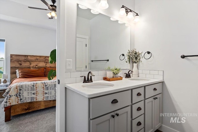 1418 N Birch St, Jerome, ID 83301 - bathroom featuring ensuite bathroom, double vanity, decorative backsplash, and a ceiling fan