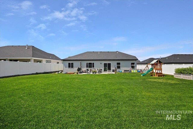 1418 N Birch St, Jerome, ID 83301 - back of property featuring a playground and a patio