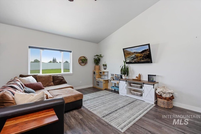 living room with dark wood-type flooring and lofted ceiling