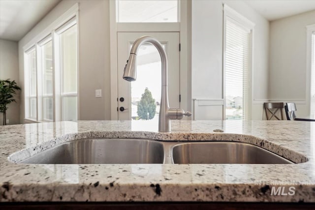 12225 W Indus Dr, Star, ID 83669 - kitchen with a sink and light stone counters