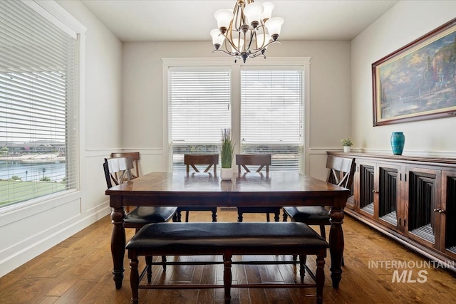 12225 W Indus Dr, Star, ID 83669 - dining area with wood finished floors and an inviting chandelier