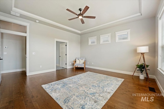 12225 W Indus Dr, Star, ID 83669 - living area featuring baseboards, visible vents, a ceiling fan, dark wood-type flooring, and a raised ceiling