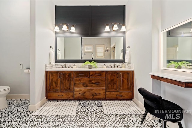 12225 W Indus Dr, Star, ID 83669 - full bath with a sink, double vanity, toilet, backsplash, and tile patterned flooring