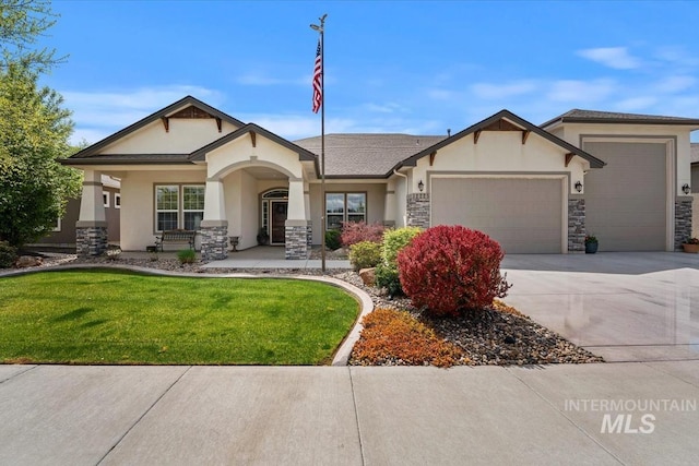 12225 W Indus Dr, Star, ID 83669 - view of front of property with a garage, stone siding, and stucco siding