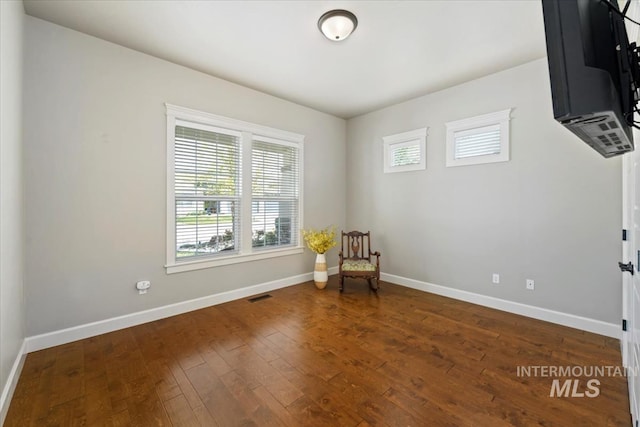 12225 W Indus Dr, Star, ID 83669 - sitting room featuring wood-type flooring, baseboards, and visible vents
