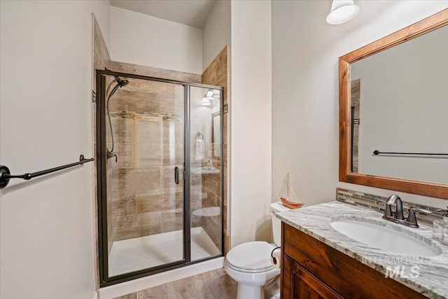 12225 W Indus Dr, Star, ID 83669 - bathroom featuring a shower stall, toilet, and vanity