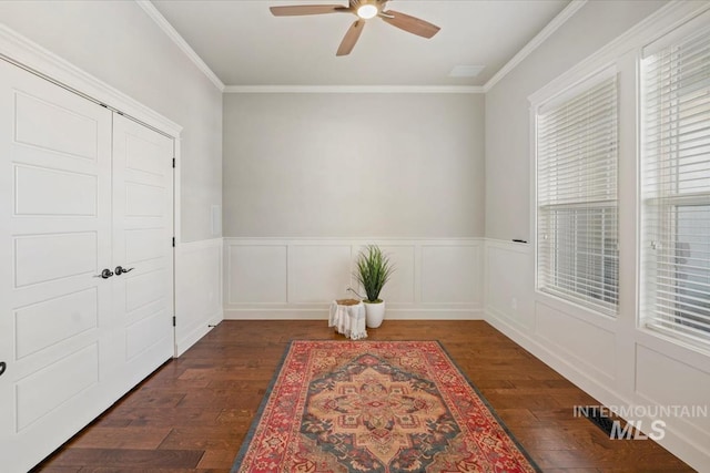 12225 W Indus Dr, Star, ID 83669 - interior space featuring dark wood-style floors, ceiling fan, a wainscoted wall, ornamental molding, and visible vents