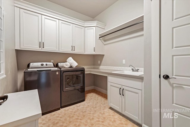 12225 W Indus Dr, Star, ID 83669 - washroom featuring washing machine and dryer, cabinet space, light floors, and a sink