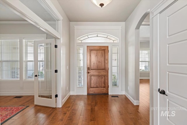 12225 W Indus Dr, Star, ID 83669 - foyer featuring french doors, arched walkways, baseboards, visible vents, and wood-type flooring