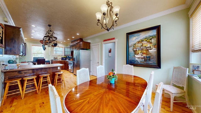 dining room with crown molding, baseboards, an inviting chandelier, recessed lighting, and light wood-style flooring