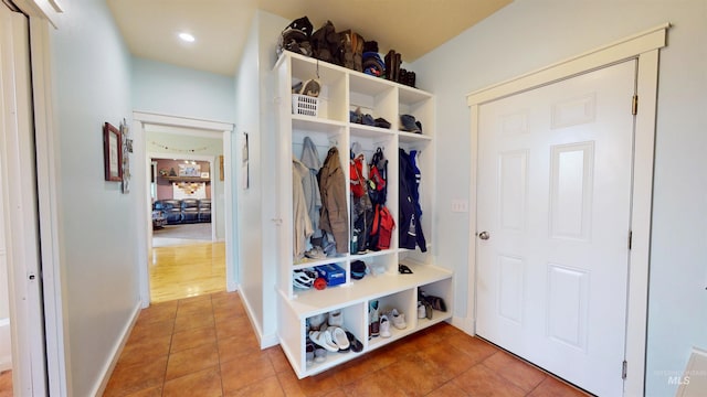 mudroom featuring baseboards and tile patterned flooring