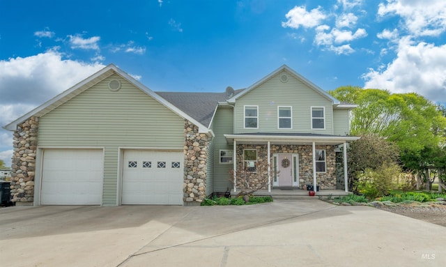 view of front facade featuring roof with shingles, stone siding, a garage, a porch, and driveway