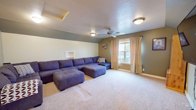 living room with carpet, attic access, a ceiling fan, baseboards, and vaulted ceiling