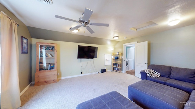 carpeted living area featuring visible vents, baseboards, attic access, ceiling fan, and independent washer and dryer