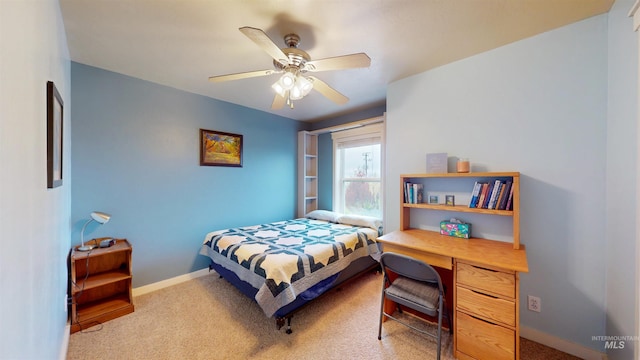 bedroom with baseboards, ceiling fan, and carpet