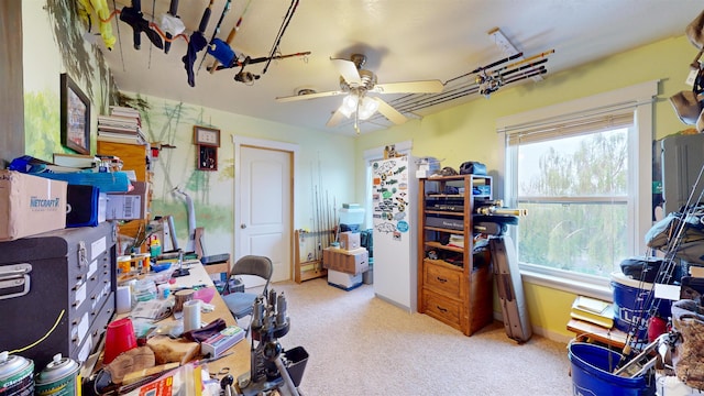 home office with carpet floors and ceiling fan