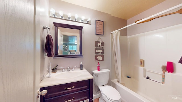 bathroom with shower / bath combo with shower curtain, toilet, and vanity