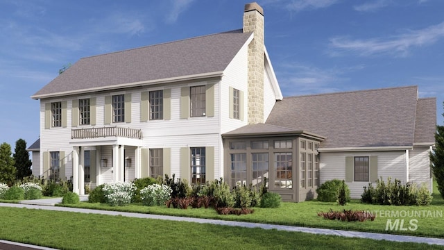 view of front of property with a chimney and a front yard