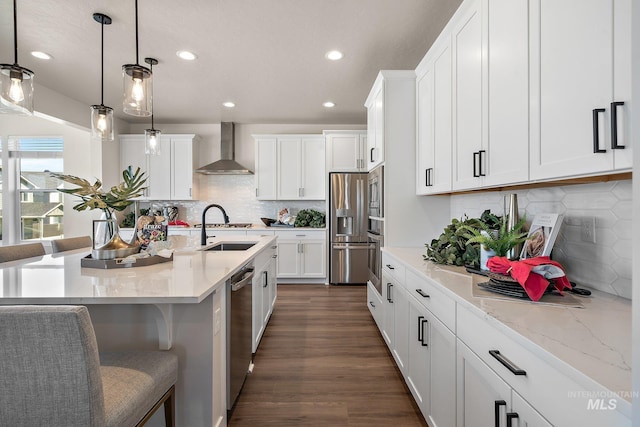 1210 Stirling Meadows Ct, Middleton, ID 83644 - kitchen featuring wall chimney exhaust hood, stainless steel appliances, recessed lighting, a sink, and white cabinets
