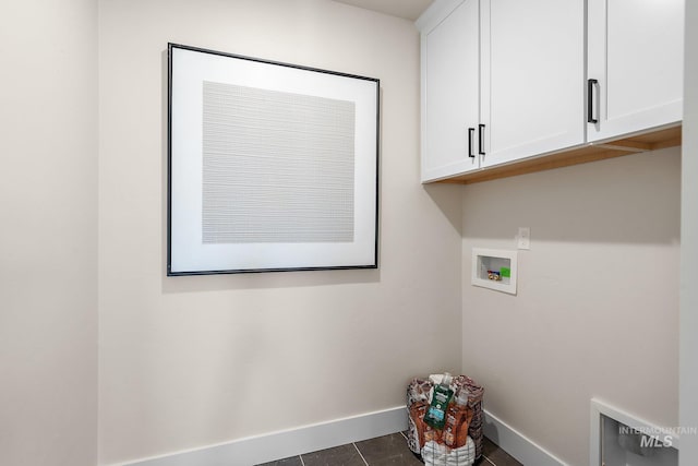 1210 Stirling Meadows Ct, Middleton, ID 83644 - washroom with cabinet space, baseboards, washer hookup, and dark tile patterned floors
