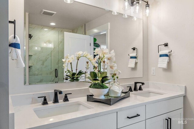 1210 Stirling Meadows Ct, Middleton, ID 83644 - bathroom featuring a marble finish shower and double vanity