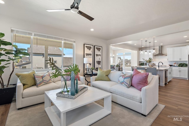 1210 Stirling Meadows Ct, Middleton, ID 83644 - living room with a ceiling fan, wood finished floors, and recessed lighting
