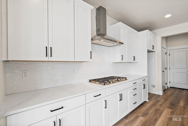 6080 N Senita Hills Ave, Meridian, ID 83646 - kitchen with wall chimney exhaust hood, white cabinetry, dark wood-style floors, stainless steel gas stovetop, and light stone countertops