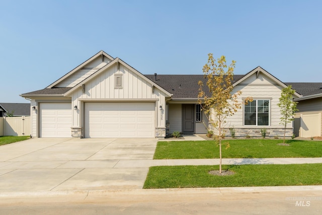 craftsman-style home with a front yard and a garage