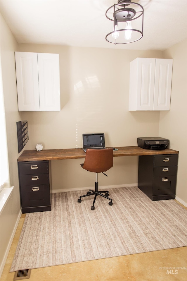 office area featuring built in desk