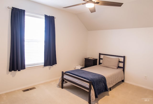 carpeted bedroom featuring ceiling fan and lofted ceiling