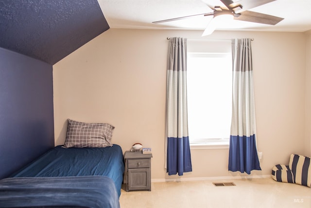 bedroom featuring carpet flooring, ceiling fan, and vaulted ceiling