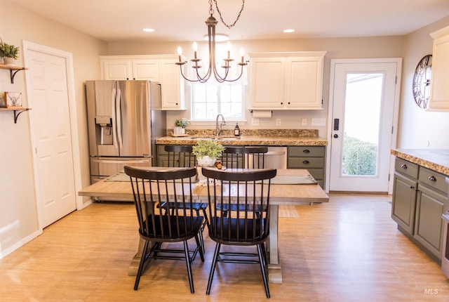 kitchen featuring white cabinets, gray cabinets, and stainless steel appliances