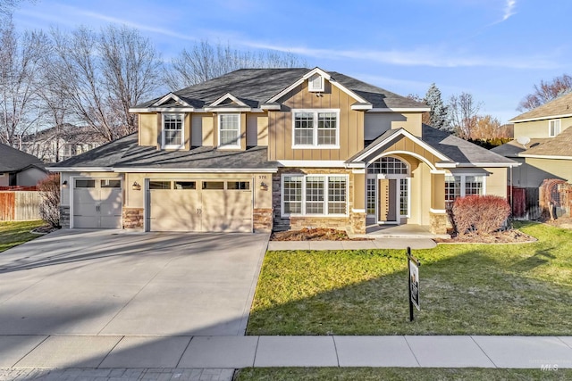 view of front facade featuring a front yard and a garage