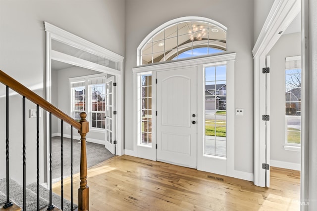 entryway with light wood-type flooring and a wealth of natural light