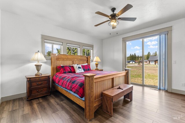 1089 Graham Dr, Mccall, ID 83638 - bedroom with access to exterior, multiple windows, and dark wood finished floors