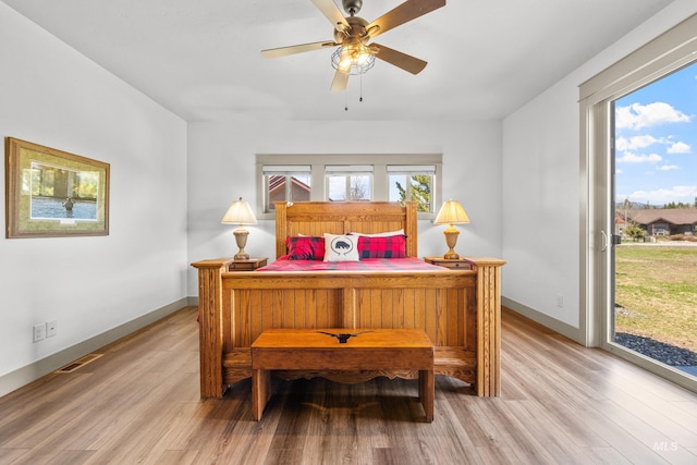 1089 Graham Dr, Mccall, ID 83638 - bedroom with access to exterior, light wood finished floors, baseboards, and a ceiling fan