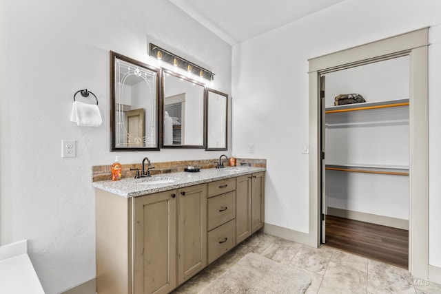 1089 Graham Dr, Mccall, ID 83638 - full bath with double vanity, a spacious closet, and baseboards