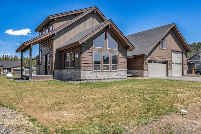 1089 Graham Dr, Mccall, ID 83638 - view of front of property featuring stone siding, a garage, a front yard, and driveway