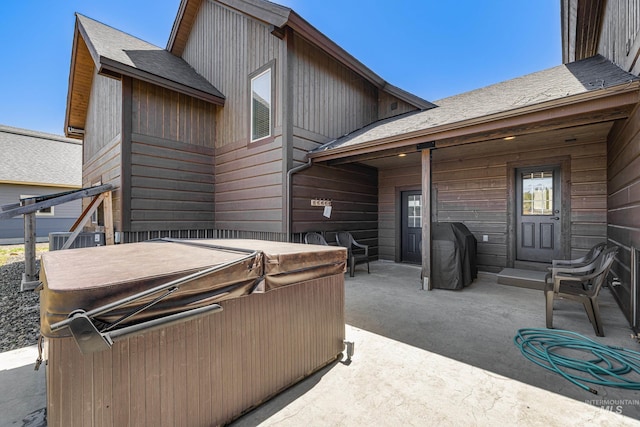 1089 Graham Dr, Mccall, ID 83638 - view of patio / terrace with a hot tub, grilling area, and central AC