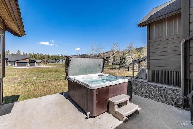 1089 Graham Dr, Mccall, ID 83638 - view of patio featuring a hot tub and a residential view