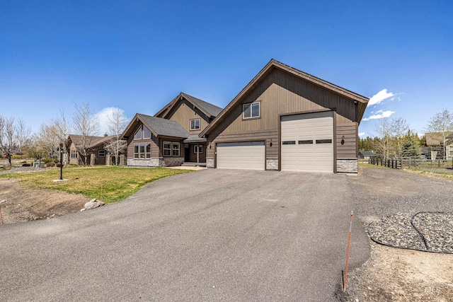 1089 Graham Dr, Mccall, ID 83638 - view of front facade featuring stone siding and a garage
