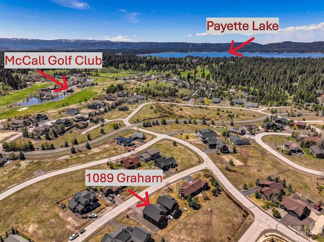 1089 Graham Dr, Mccall, ID 83638 - aerial view of property and surrounding area featuring a nearby body of water, a forest, and nearby suburban area