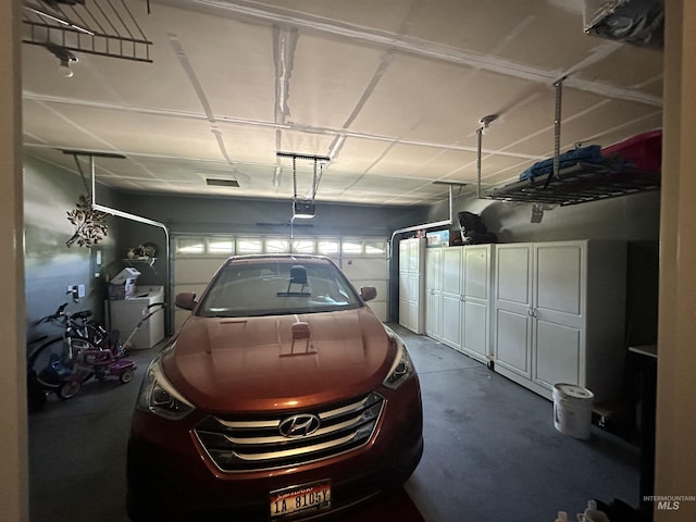12030 Abram St, Boise, ID 83713 - garage featuring a garage door opener