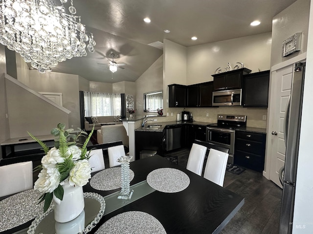 12030 Abram St, Boise, ID 83713 - dining space featuring a ceiling fan, dark wood-type flooring, recessed lighting, lofted ceiling, and a chandelier