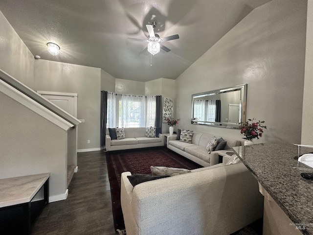 12030 Abram St, Boise, ID 83713 - living area featuring vaulted ceiling, ceiling fan, and dark wood-style flooring